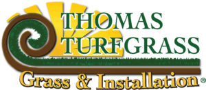 A logo for thomas turgeson grass and installation.